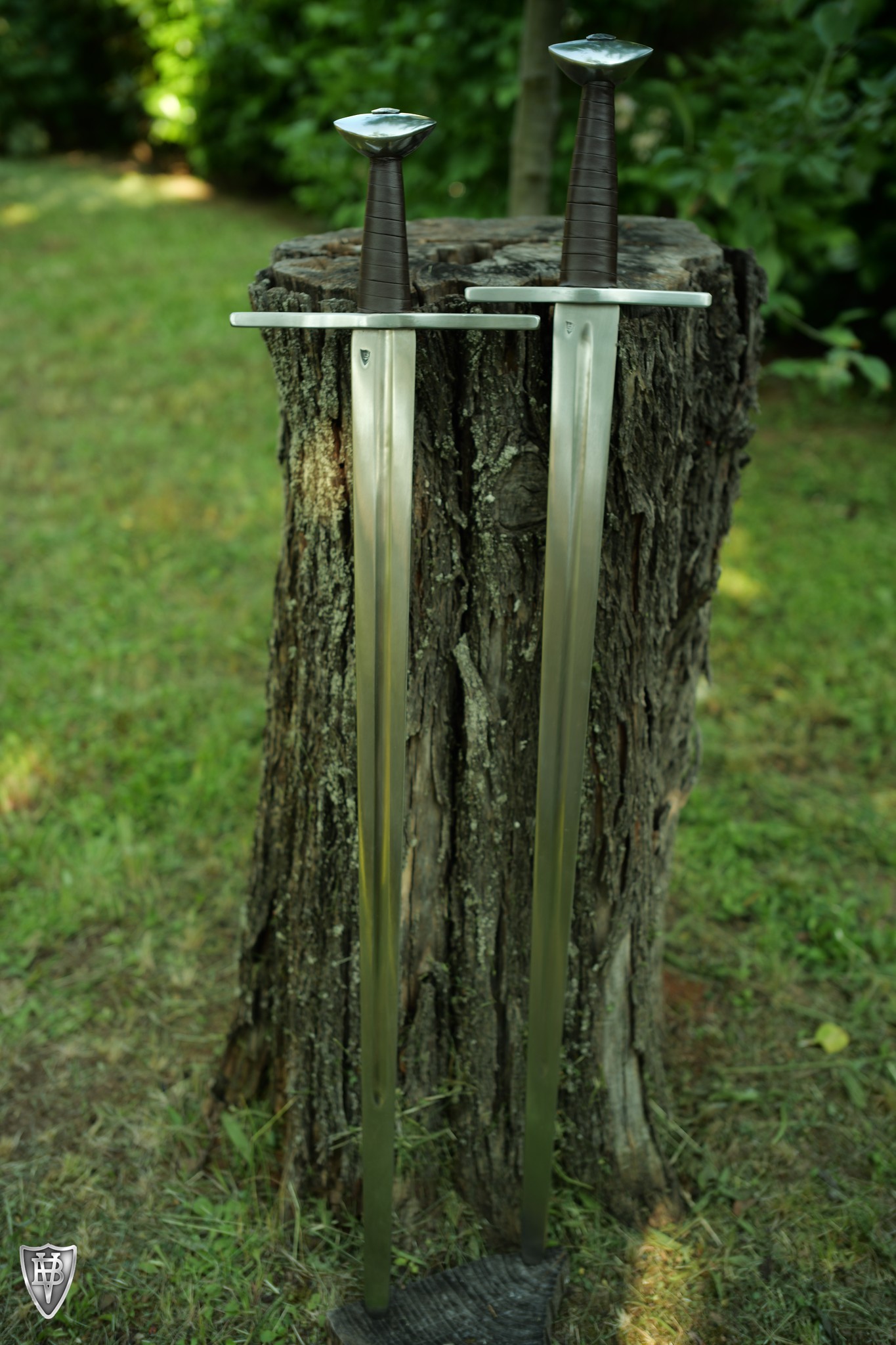 two swords with different hilt sizes